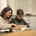 elder sister and brother studying at home